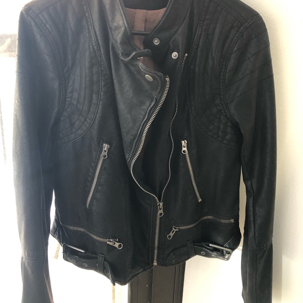 Free People vegan leather jacket. Size M. Never worn, tag attached.
